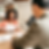 Black female sitting at desk with Asian man