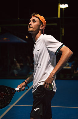 Dramatic action shot of padel player striking ball at Masterball tournament, Padel K, Cyprus
