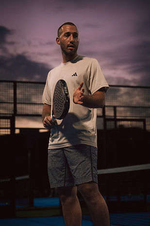 Dramatic action shot of padel player striking ball at Masterball tournament, Padel K, Cyprus