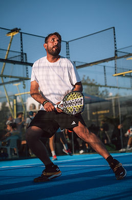 Dramatic action shot of padel player striking ball at Masterball tournament, Padel K, Cyprus.