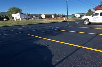Quality asphalt seal coating and paving service offering a smooth and hard-wearing surface intended for durability and a prof