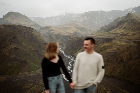 burry engaged couple in the foreground, Iceland Valley of Thor in the background.