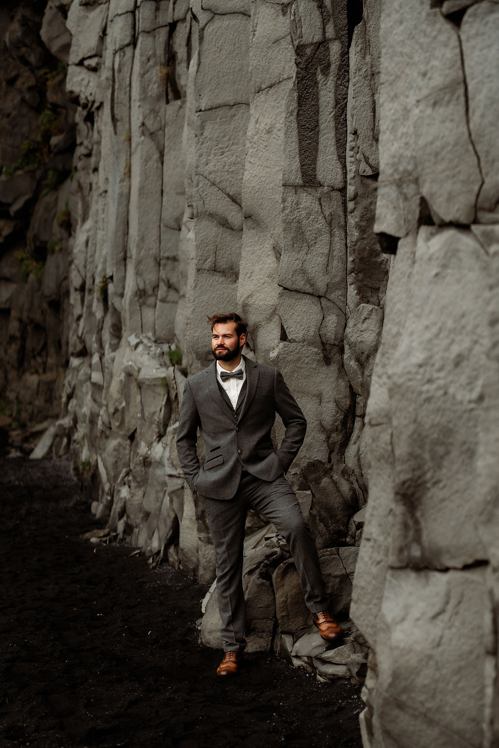 groom poses for iceland elopement photographer.
