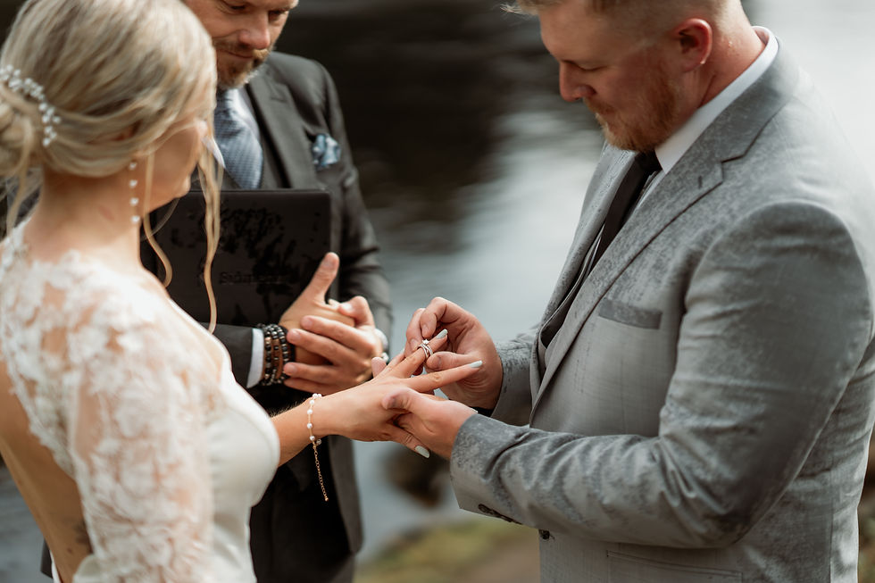 Bride and groom get married and put wedding rings on each other.