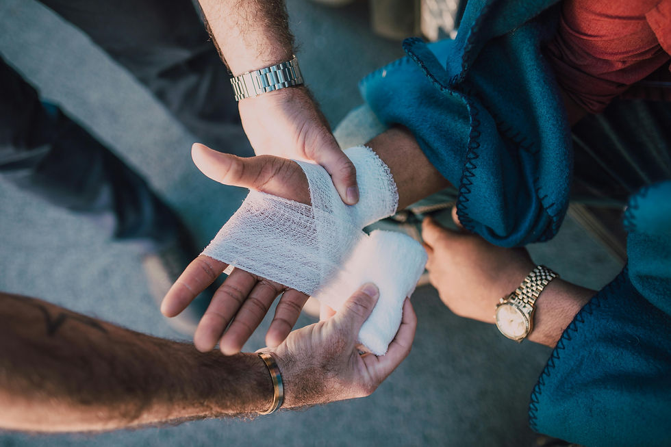 Close-up of hands wrapping a bandage around a wrist.