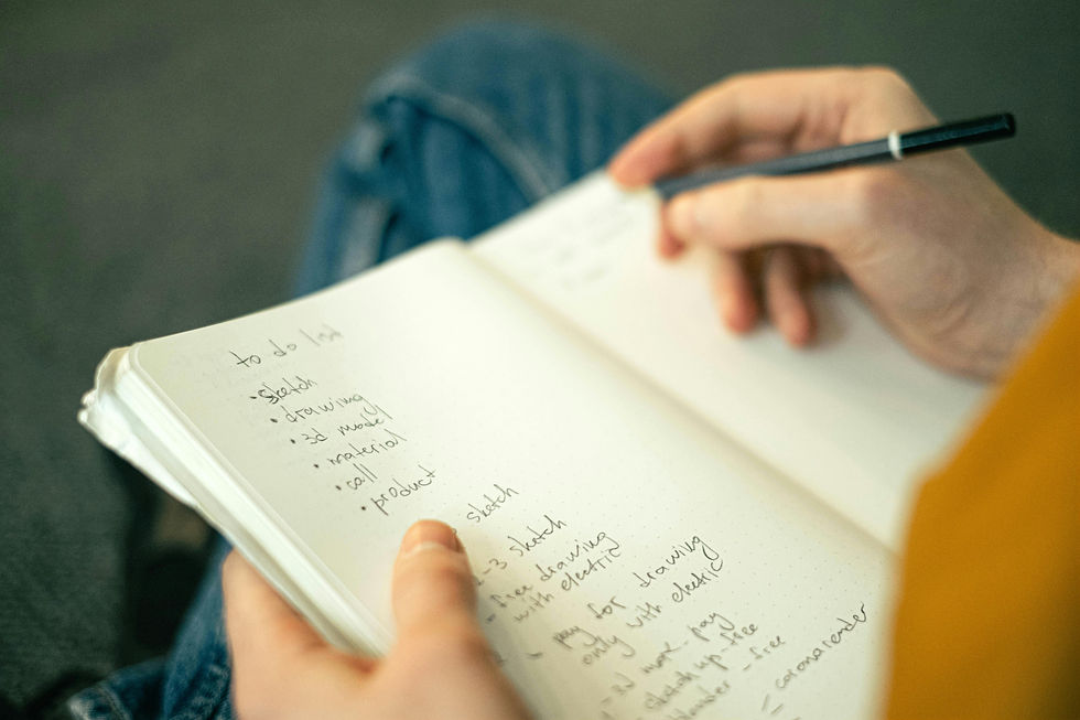 A person putting some items down on a list