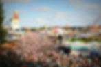 A huge crowd of people gathered at a theme park