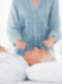 Female%20therapist%20performing%20Reiki%