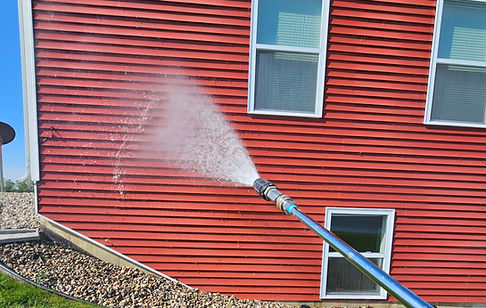 pressure washing red house.jpg