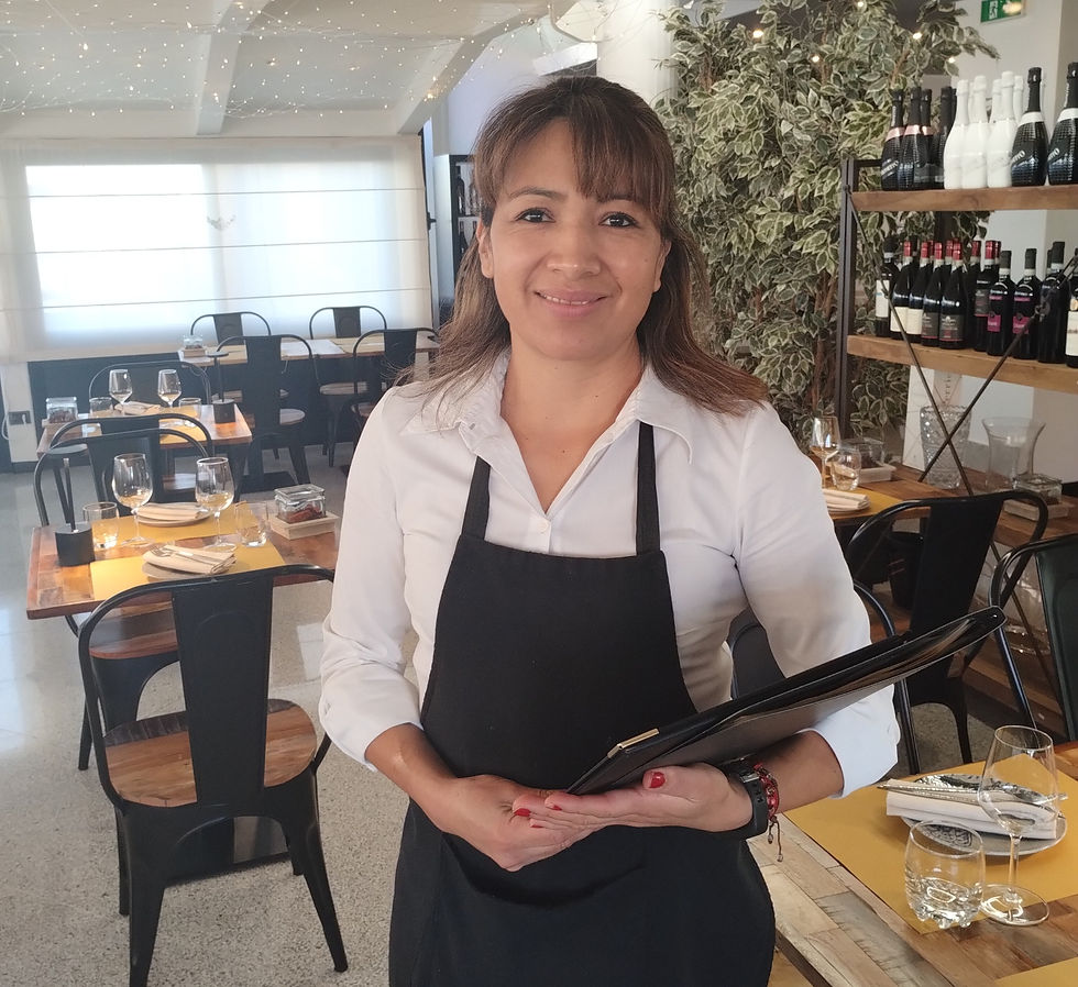 woman-stand up-with-menu-white-shirt-black-apron