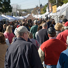 Customers at an outdoor craft show.
