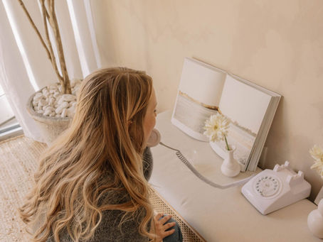 Woman using audio guestbook phone