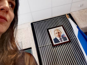 a woman looking at a picture