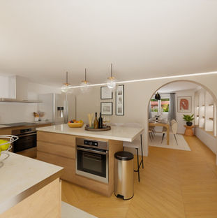 Cuisine spacieuse et moderne avec un îlot central élégant, alliant fonctionnalité et style.