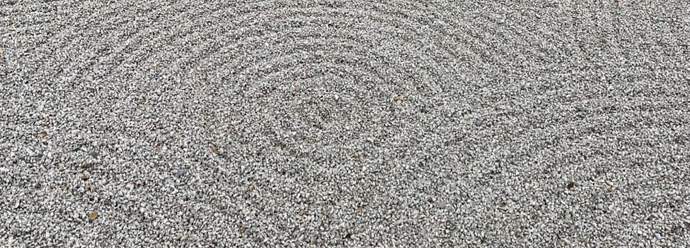 sand arranged in circular arcs in a Japanese zen garden