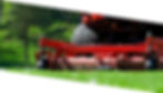 a close up of the back of a red commercial lawn mower, the blades can be seen cutting grass