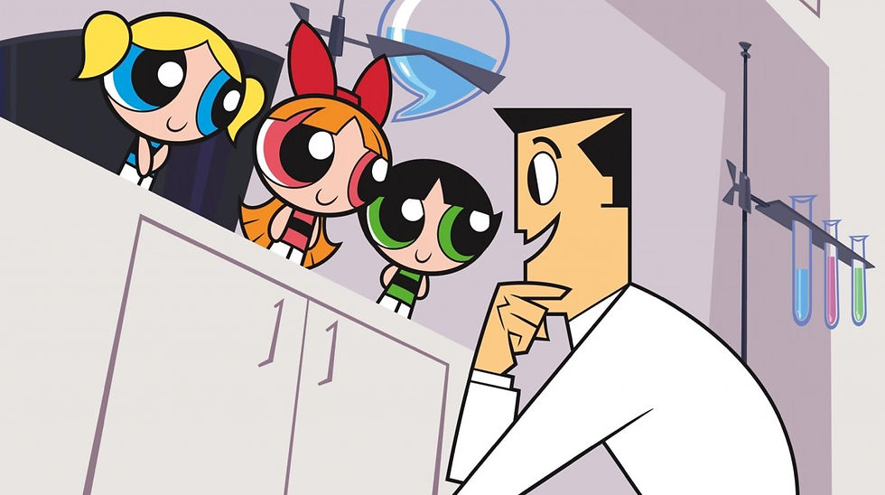 Professor ajoelhado no laboratório conversando com as Meninas, que estão em cima de uma bancada. O Professor é moreno com jaleco branco, Docinho é morena, cokm olhos e vestido verde, Florzinha é ruiva com olhos e vestido rosa e Lindinha é loira com olhos e vestido azul.