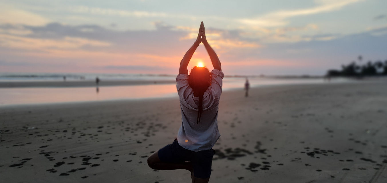 ash, yoga Instructor doing yoga on sunset beach