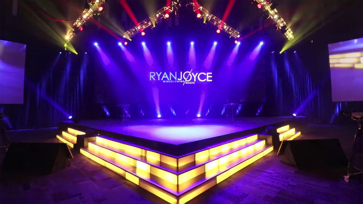 The CIM-Caterpillar Gala event branding and stage setup prior to Ryan Joyce’s performance.