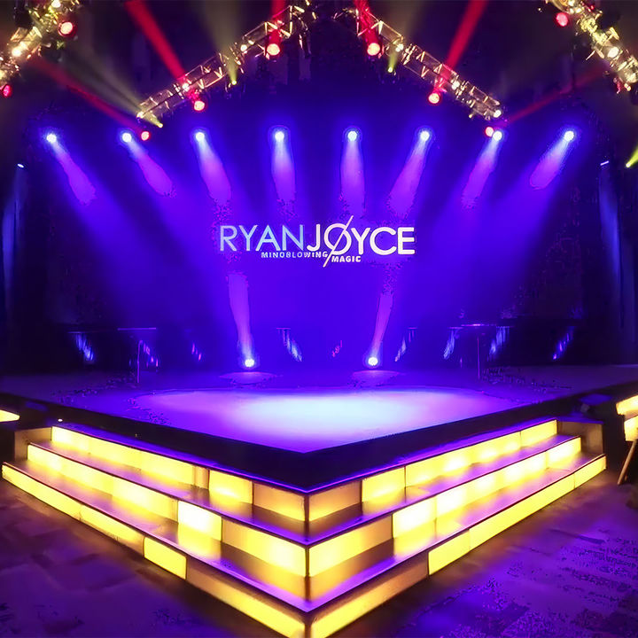 A cinematic view of the Banquet Show stage setup with modern lighting and high-definition video screens.