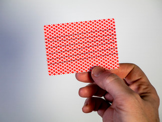 Exposed view of the thread wrapped around a playing card