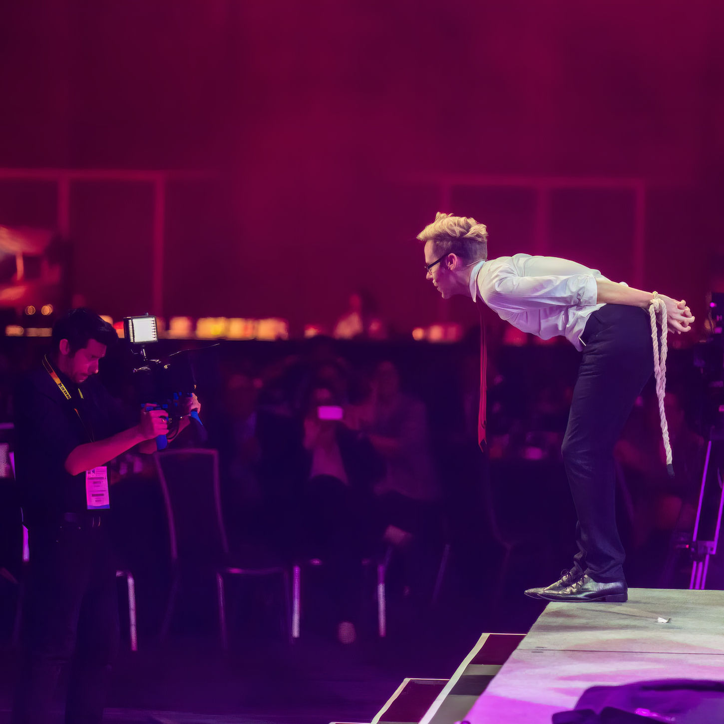 Ryan Joyce engaging directly with an audience member during a lighthearted and amazing magical routine.