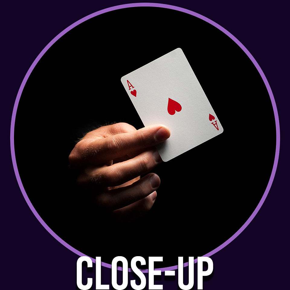 A magician holding a playing card