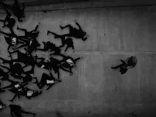 Men lying on the concrete in Bulk