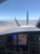 Navigating an airplane through weather with only reference to its instruments