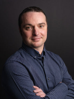 Dr. Bryan Gastelle, PsyD, clinical psychologist and founder of Empower Psychotherapy, smiling in a professional portrait.