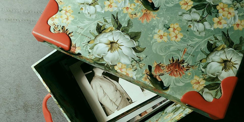 Floral-patterned box with red accents, open to reveal black-and-white photos. Green background with flowers and text "beautiful love."