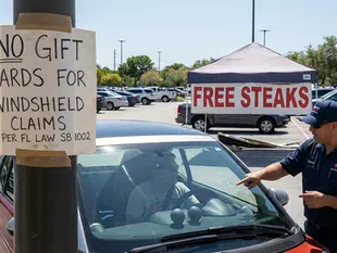 Florida law bans gift cards for windshield claims.