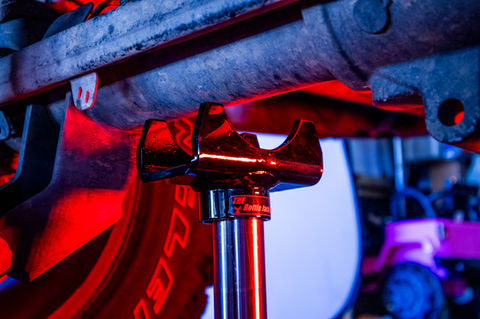 Bottle Jack Axle Adapter Lifting Saddle. Bottle Jack Tools and Accessories, Bottle Jack Kit, Bottle Jack Parts, Bottle Jack Plate. This axle saddle fits right on your hydraulic bottle jack and holds your axle tube while you jack up the axle. The product was designed for lifting an axle with a bottle jack. It just slips on and doesn't require any welding! This is the perfect automotive tool to keep in your vehicle when using a bottle jack on an axle. This bottle jack axle bracket will help lift a vehicle from the axle more securely rather than putting just the bottle jack pad on the axle. Will hug and cradle axles up to 3 inch tubes. It's the perfect bottle jack adapter for the garage, the 4x4 trail, Jeep, RV, travel trailer, farm, ranch.