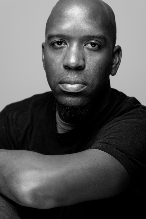 a man is wearing a black shirt