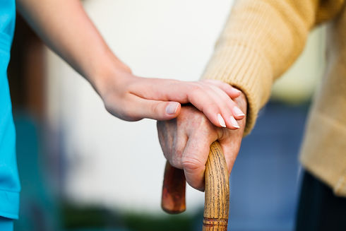 Doctor holding a senior patients 's hand