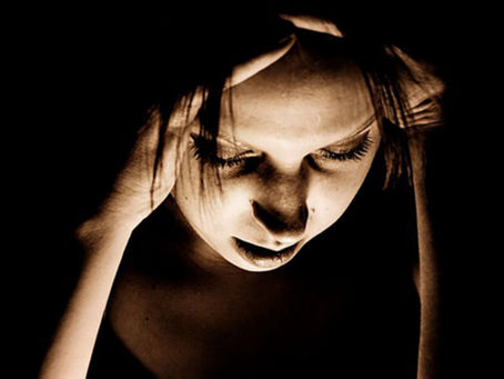 woman suffering from migraine