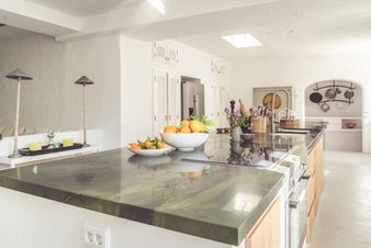 Bright finca kitchen with fresh fruit and vegetables on the kitchen island