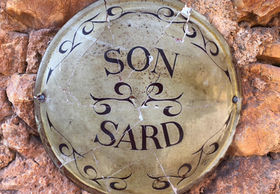 Traditional Son Sard sign on the stone wall of the retreat finca in Mallorca
