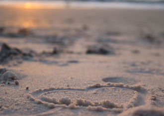 Heart drawn in the sand on a beach in Mallorca