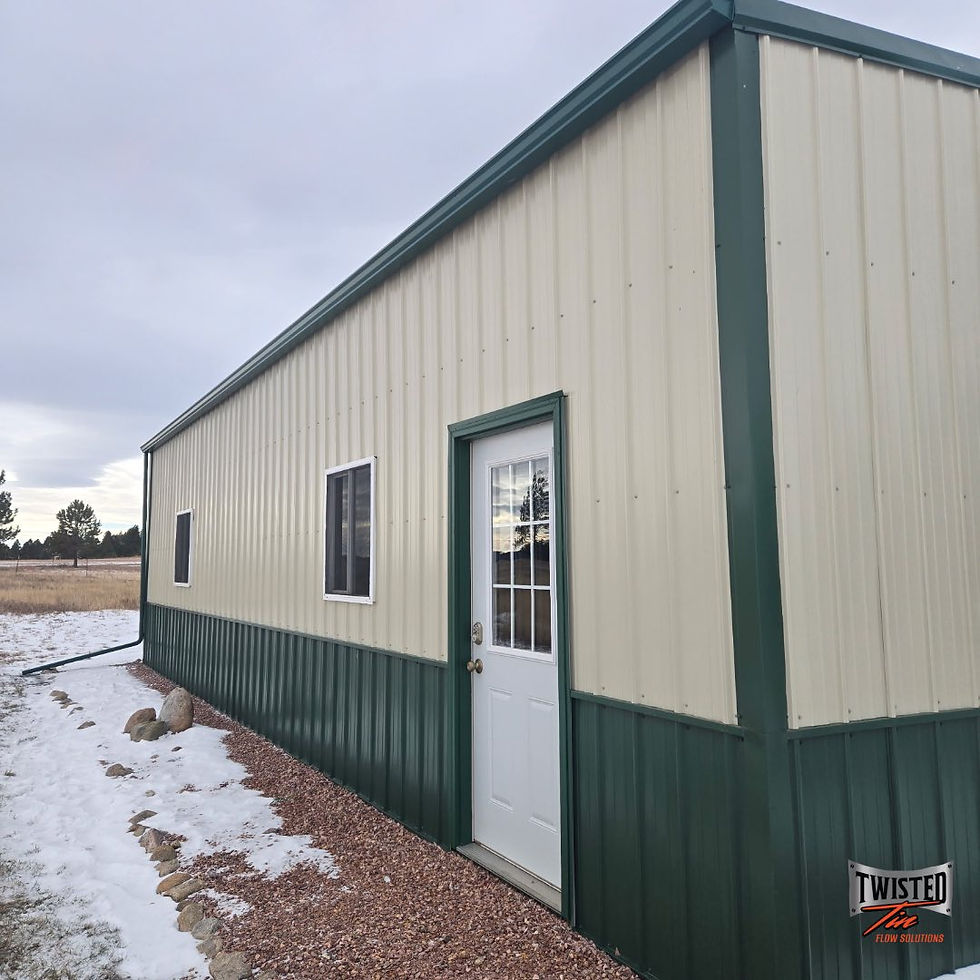 Beige and green building with green gutters