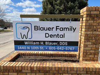 Blauer Family Dental sign with contact details and William H. Blauer, DDS