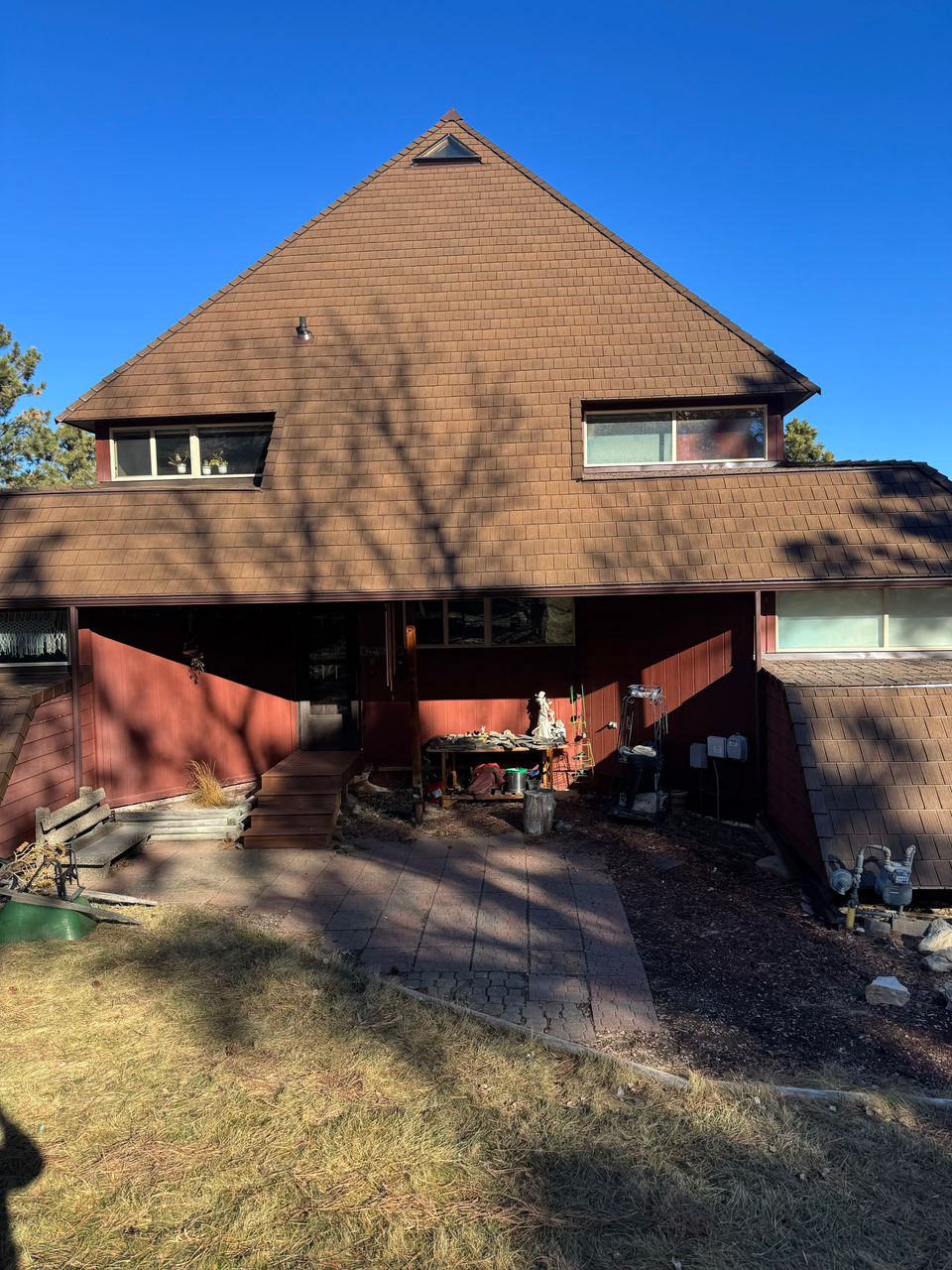 Red house with brown gutters