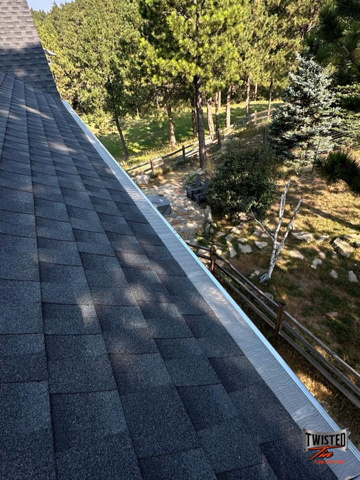 Close up of white gutters and roof line