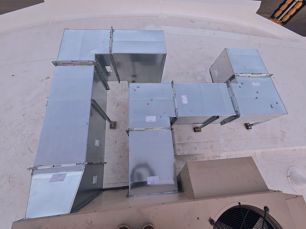 Complex HVAC ductwork installation showing precision-fit custom metal transitions.