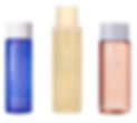 Three skincare toner bottles: blue "Ole Henriksen," beige "numbuzin," pink "Fenty Skin." White background, no text or graphics besides labels.