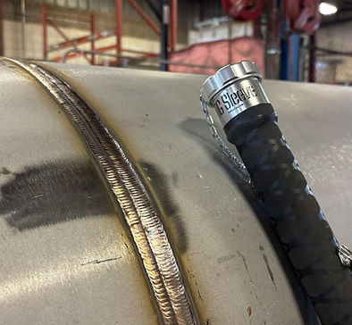 TIGSleeve filler rod storage tube used beside an industrial pipe weld