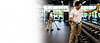 CleanPro 360 employee cleaning a fitness center reception area while maintaining a clean, welcoming gym environment.