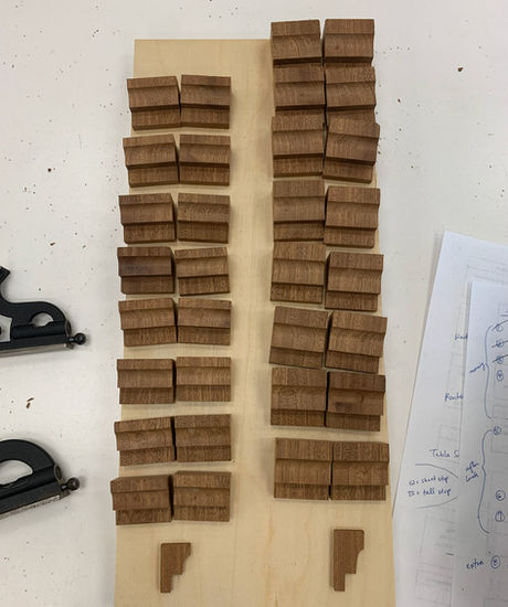 Sixteen short stops and fourteen tall stops are pictured laid out on a panel. They're organized into two separate areas, with each area having a sectional cut out next to them to illustrate the side profile.