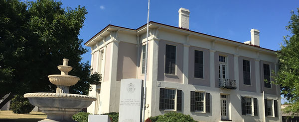 Historic Greene County Courthouse in Eutaw, Alabama, with fountain