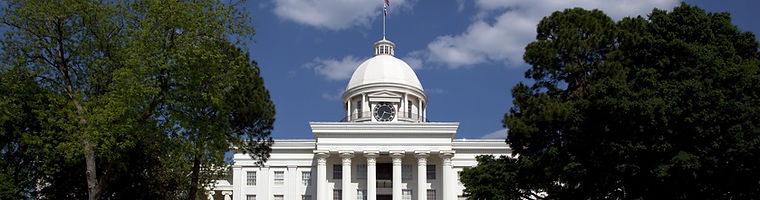 Alabama State Capitol in Montgomery, Alabama, framed by trees